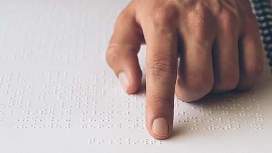 Man reading braille